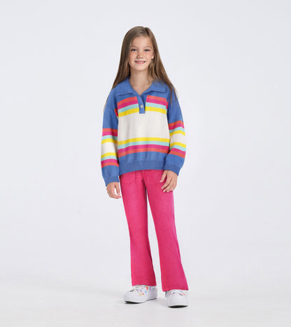 Colorblock sweater featuring blue, white, and vibrant stripes, paired with pink pants, suitable for casual wear.