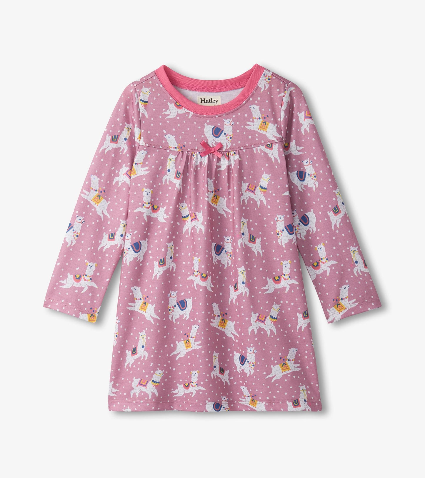 Long sleeve nightdress in pink with a playful alpaca print and polka dots, featuring a gathered bodice and bow detail.