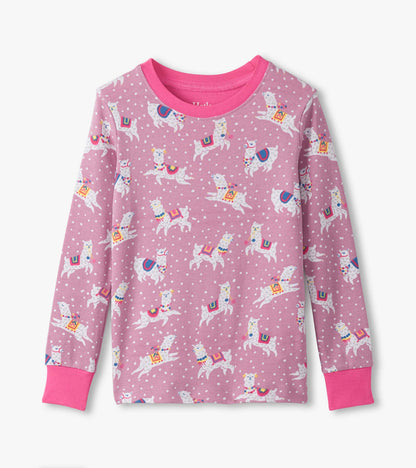 Pink cotton pajama top featuring playful dancing alpacas and polka dots, with long sleeves and a bright pink neckline.