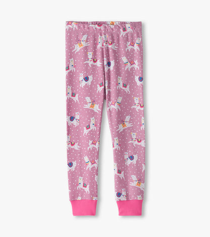 Pink cotton pajama pants featuring a playful alpaca pattern and polka dots, with elastic waistband and pink cuffs.