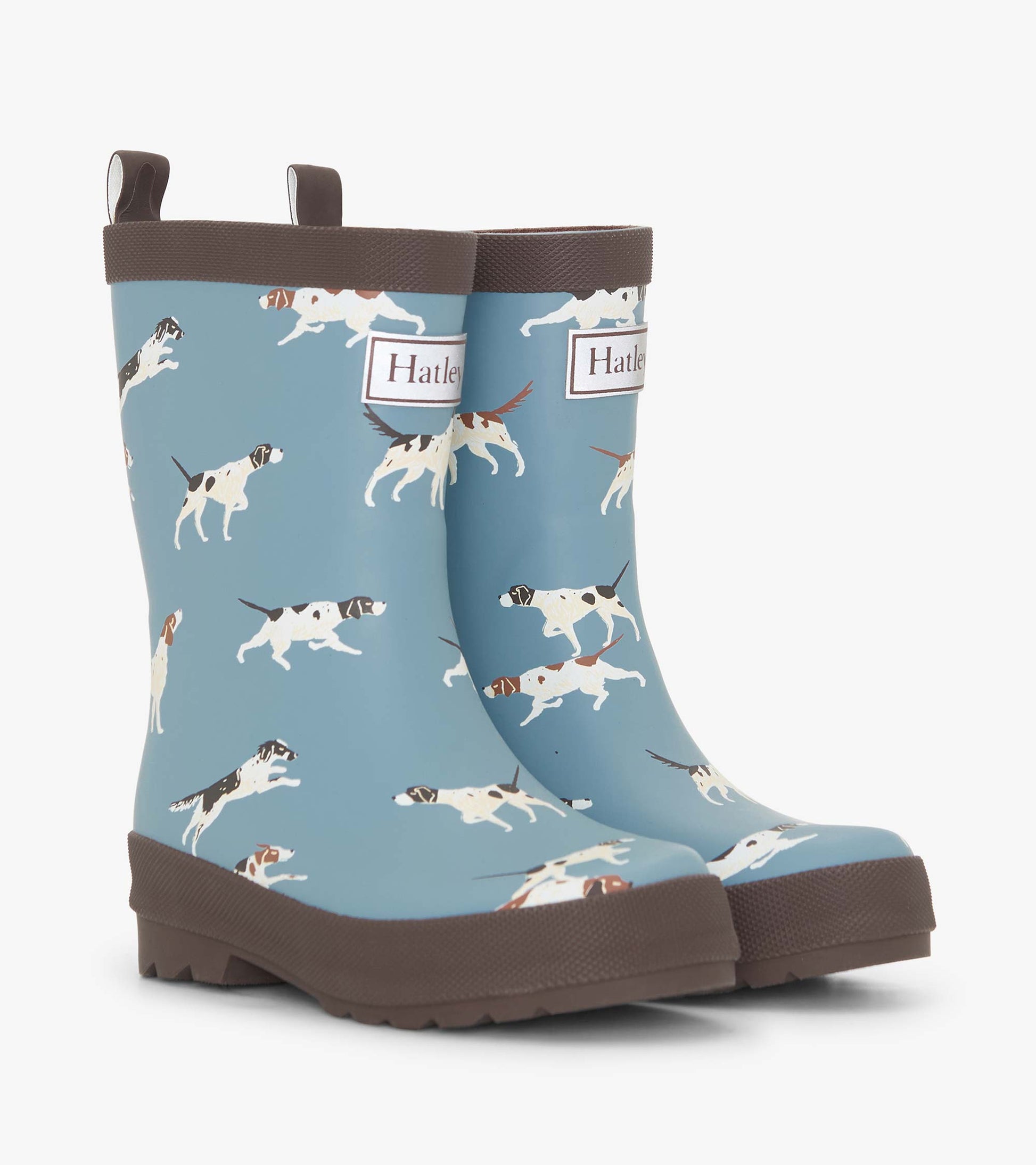 Matte blue rain boots featuring playful dog patterns and brown soles, designed for boys.