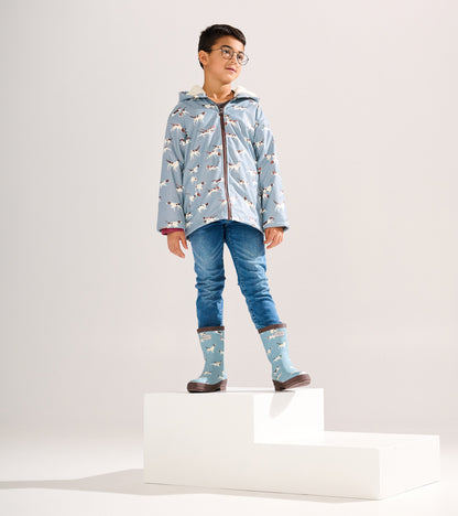 Matte blue rain boots with hunting dog pattern, featuring a brown sole, suitable for boys.