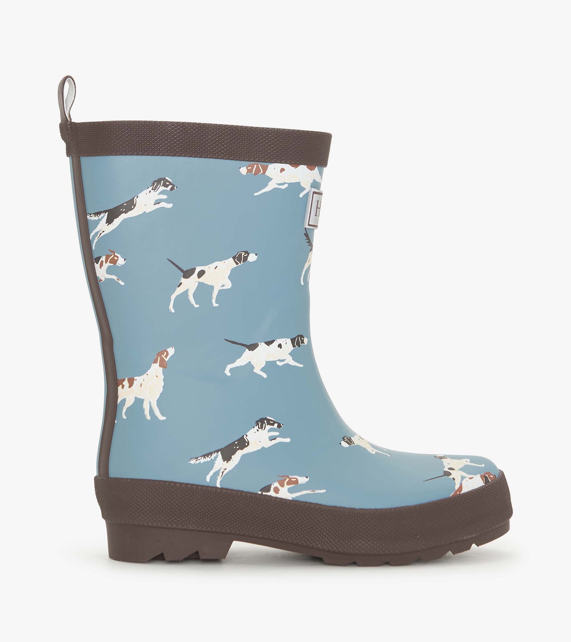 Matte blue rain boots featuring a playful pattern of running dogs, with a brown rubber sole and trim.