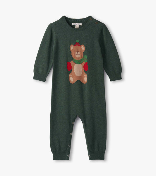 Green knitted romper featuring a teddy bear design on the front, with long sleeves and snap closures at the bottom.