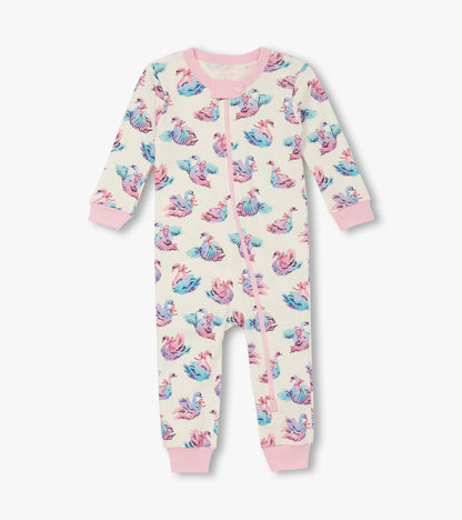 Cotton sleeper for baby girls featuring a pastel swan print with pink cuffs and a front zipper closure.