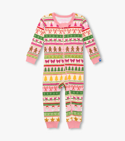Pink cotton sleeper featuring a fun Fair Isle pattern with gingerbread, bows, trees, and festive motifs.