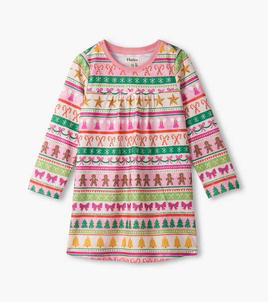 Pink long sleeve nightdress featuring a fun Fair Isle pattern with gingerbread, bows, and festive motifs.