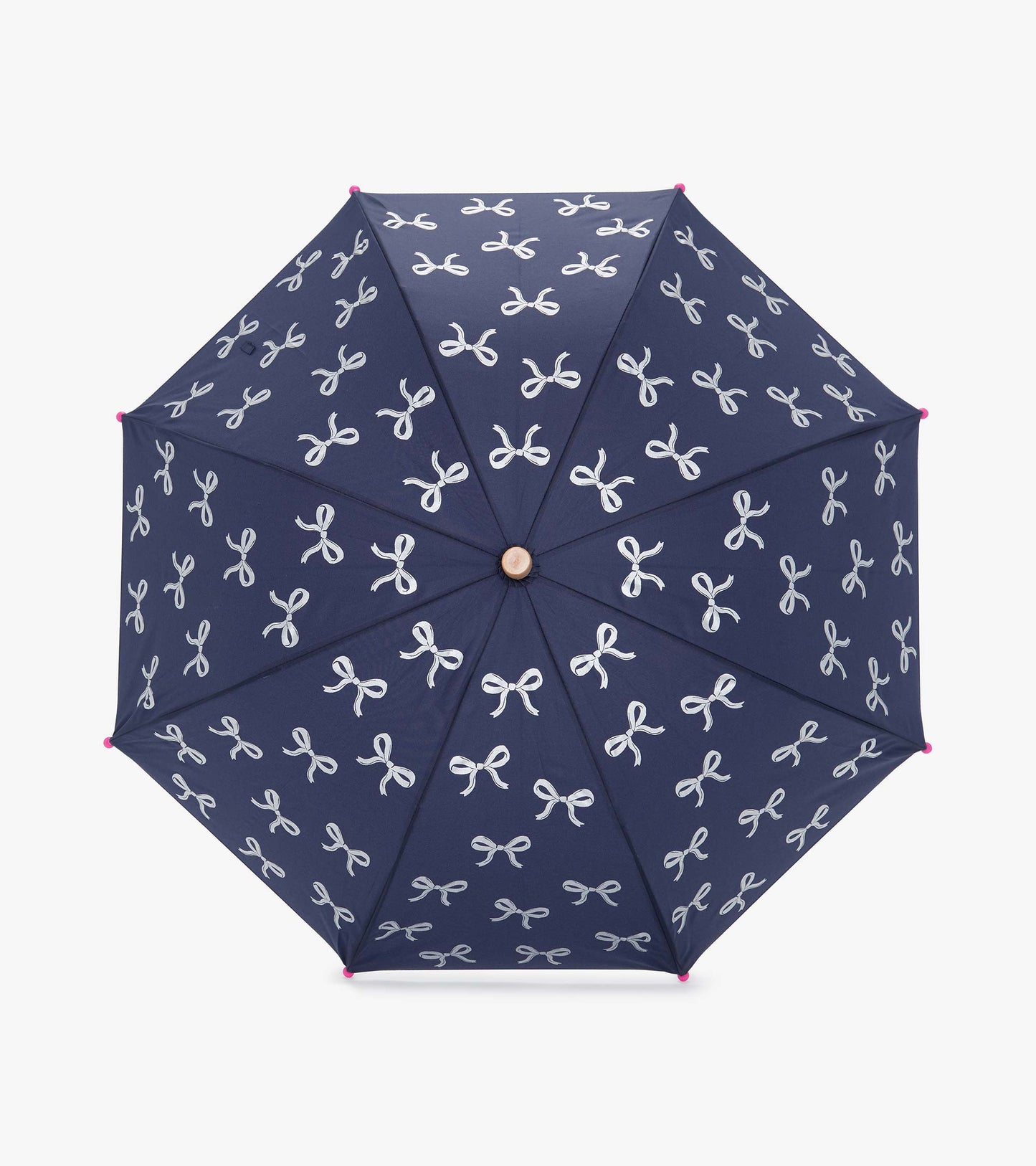 Navy umbrella with white ribbon patterns and pink tips, featuring an octagonal shape for rain protection.