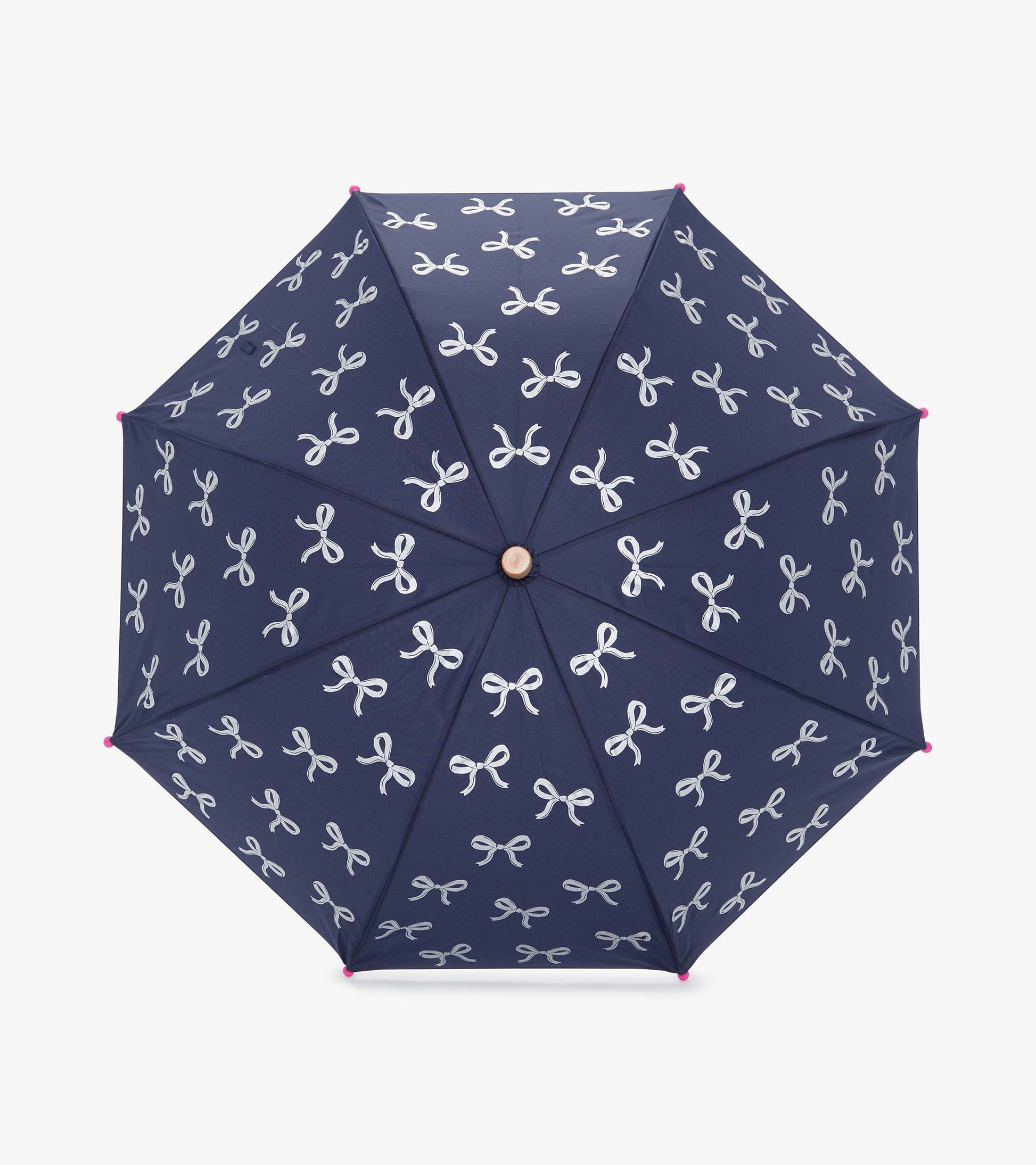 Navy umbrella with white ribbon patterns and pink tips, featuring an octagonal shape for rain protection.