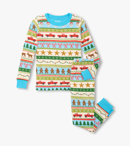 Boys' blue cotton pajama set featuring a festive Fair Isle pattern with Santa, trees, and gingerbread men.