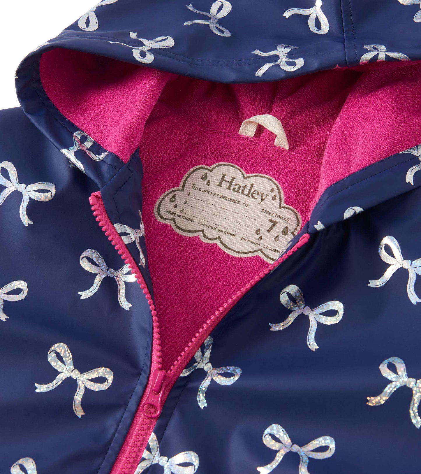 Navy rain jacket with silver ribbon pattern and pink fleece lining, featuring a zip-up front and hood.