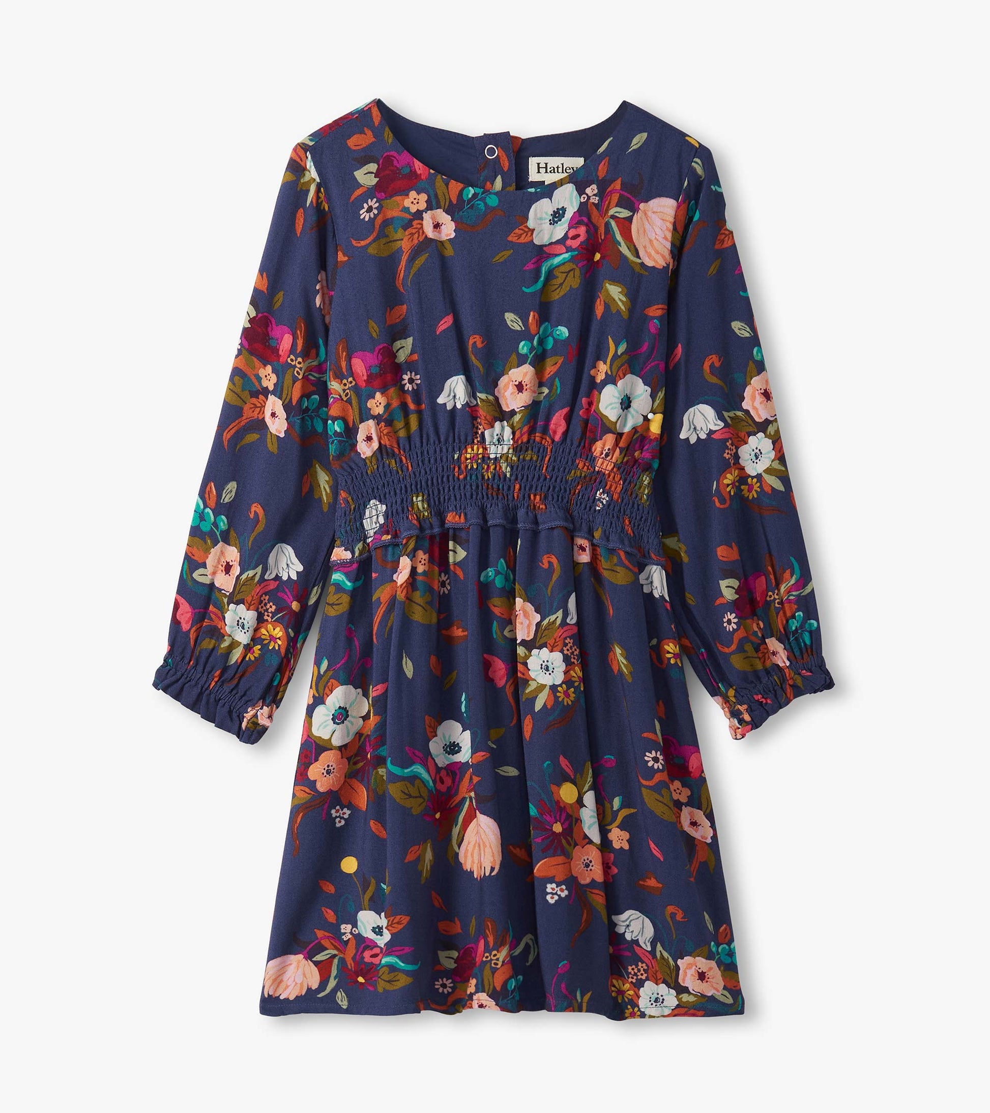 Navy dress with long sleeves, floral pattern in vibrant colors, smocked waist, and a round neckline.
