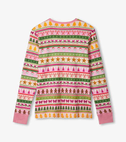 Pink cotton pajama set featuring a festive Fair Isle pattern with Christmas motifs, long sleeves, and a crew neck.