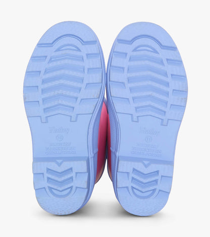 Fuchsia matte rain boots with a textured blue sole, designed for girls, suitable for wet weather.