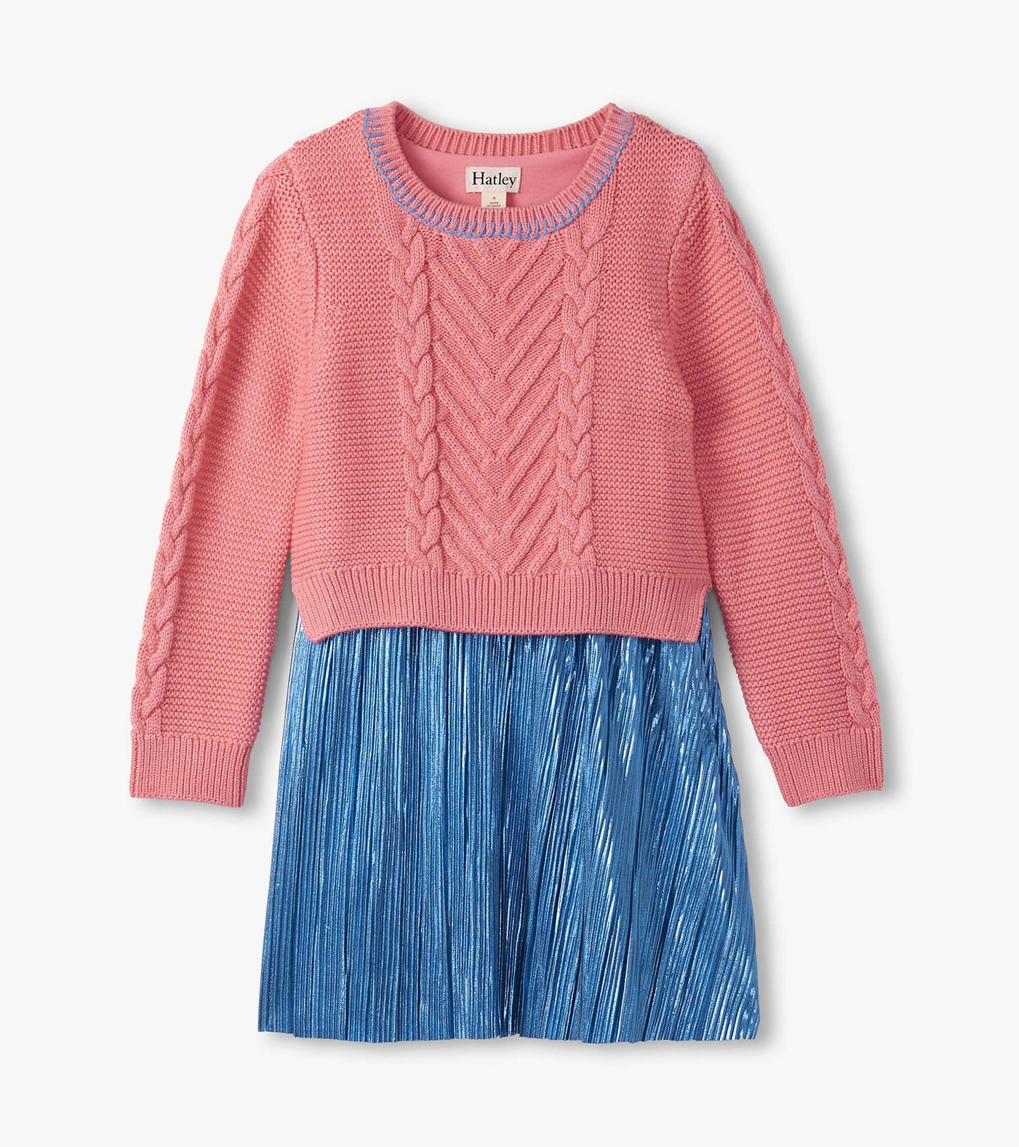 Flamingo pink knit top with cable pattern and blue pleated skirt, perfect for casual wear.