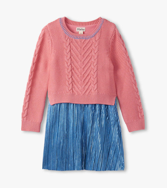 Flamingo pink knit top with cable pattern and blue pleated skirt, perfect for casual wear.