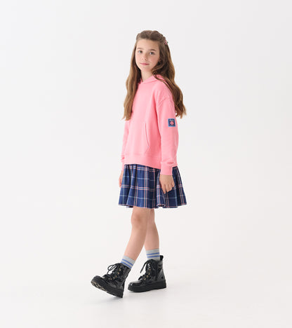 Girls' preppy plaid dress with a navy blue skirt and pink hoodie, paired with black boots and striped socks.
