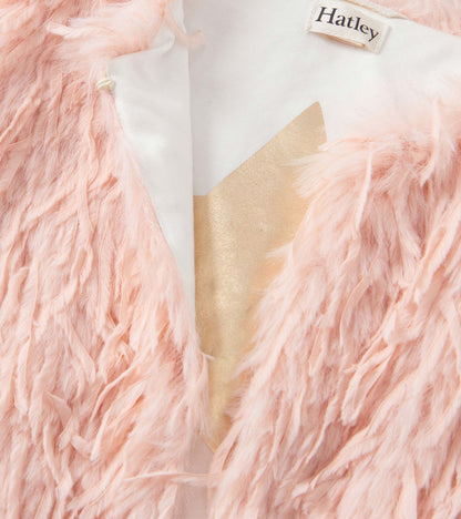 Pale pink faux fur vest with a soft, textured exterior and a smooth inner lining.