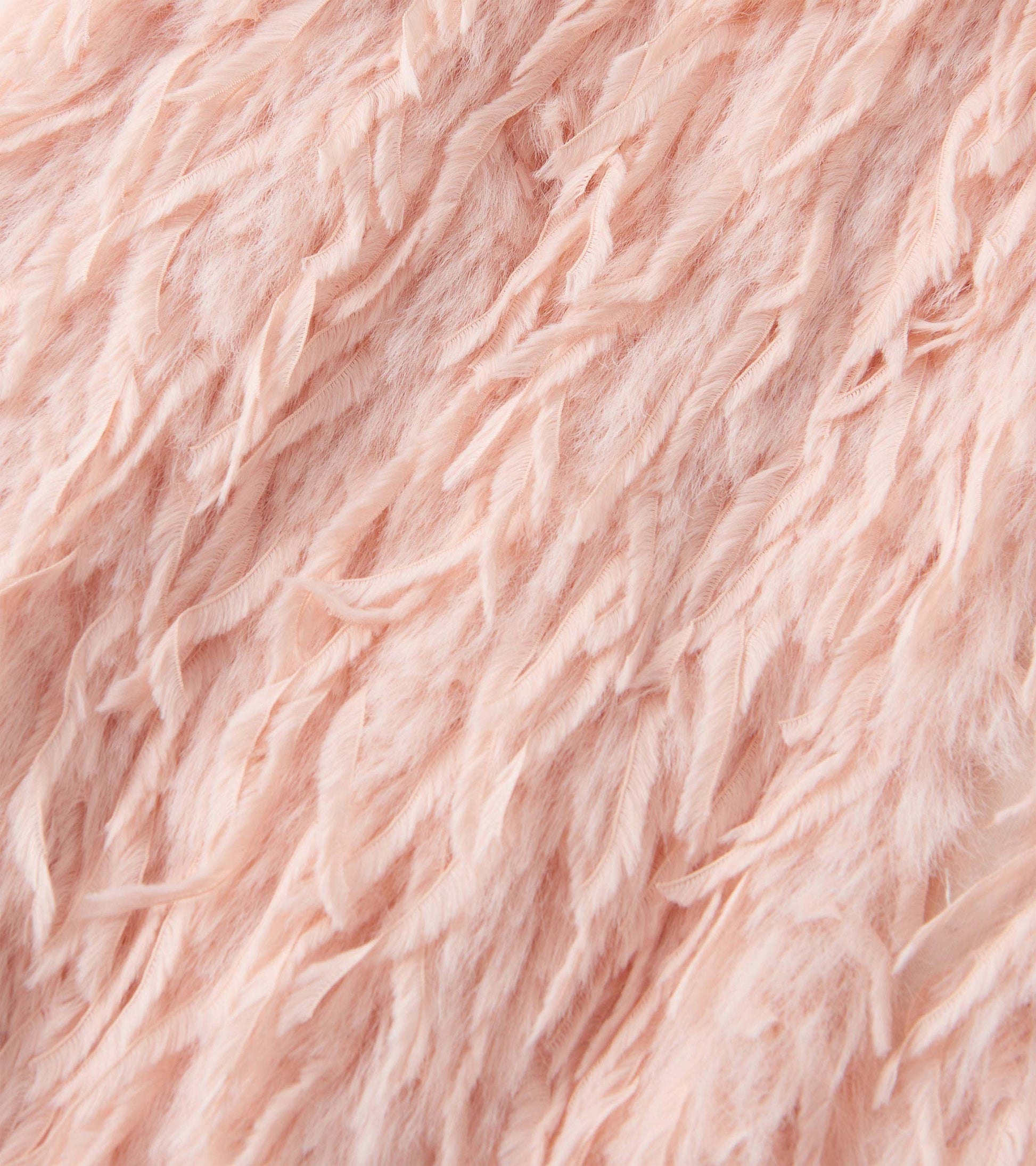 Pale pink faux fur vest with a soft, textured finish, featuring a feathery pattern suitable for girls.
