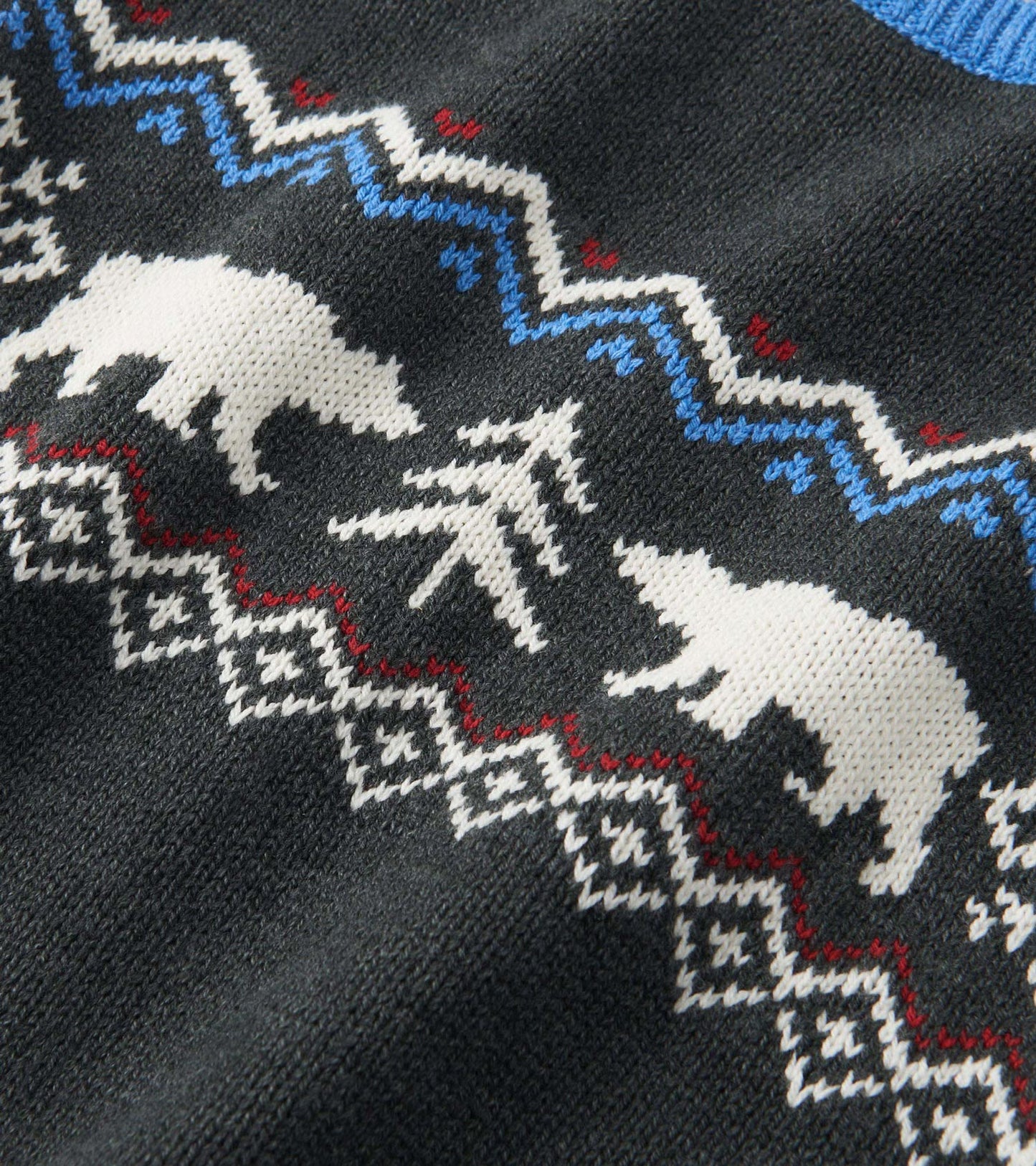 Black crew neck sweater featuring a winter-themed pattern with white bears and trees in contrasting colors.