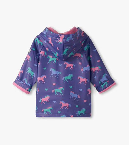 Purple rain jacket featuring colorful unicorns and hearts, with a hood and pink trim, suitable for baby and toddler girls.