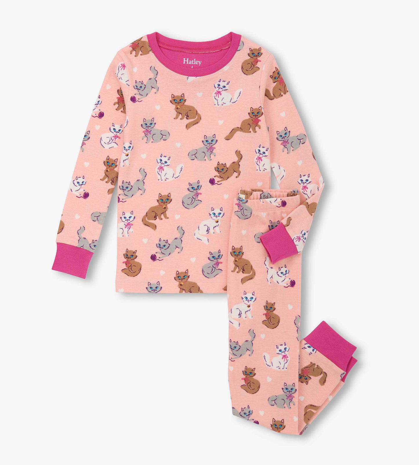 Pink cotton pajama set featuring playful kitty patterns, long sleeves, and matching pants with pink cuffs.
