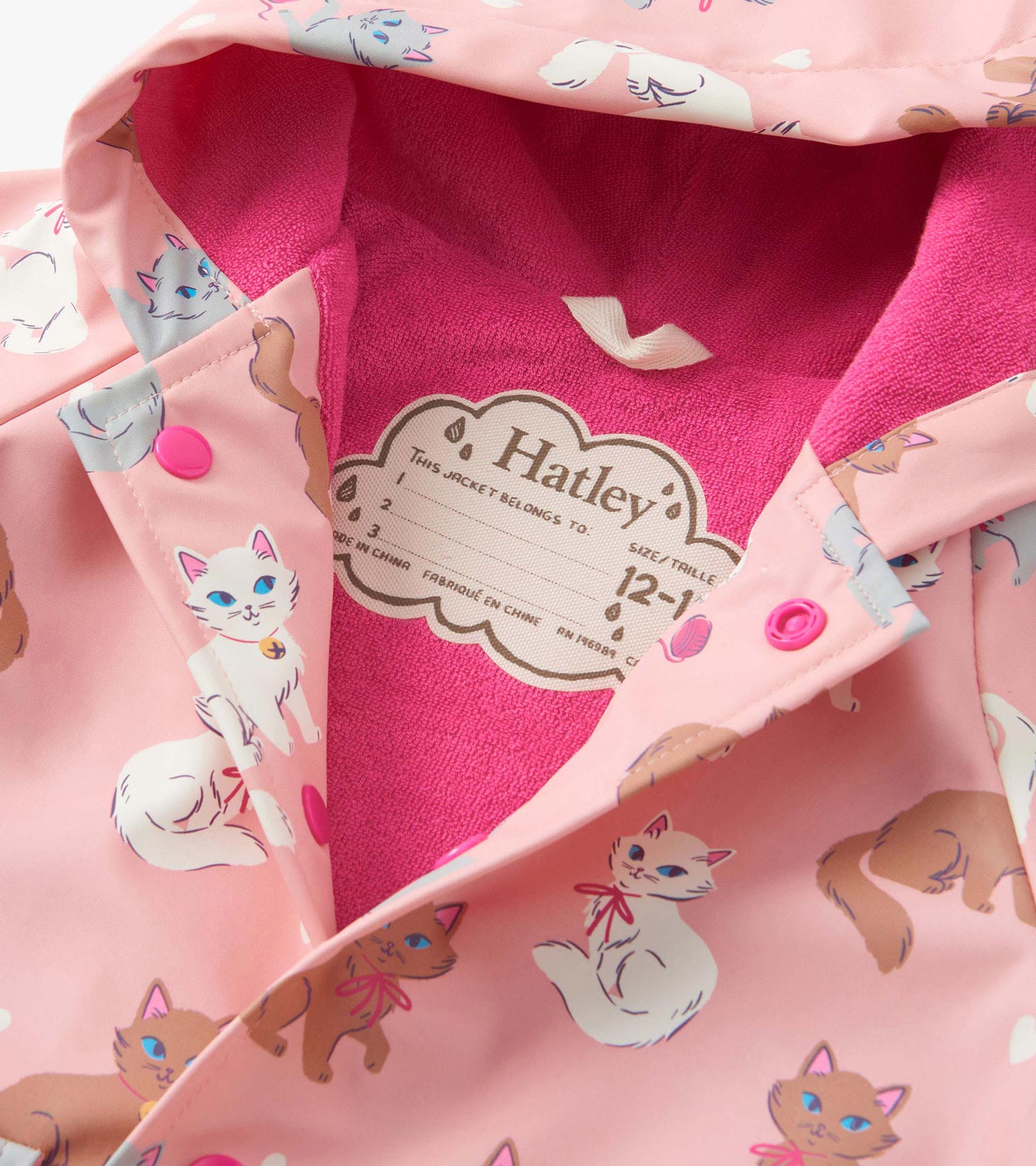 Pink button-up rain jacket featuring playful kitty patterns and a soft pink lining, suitable for baby and toddler girls.