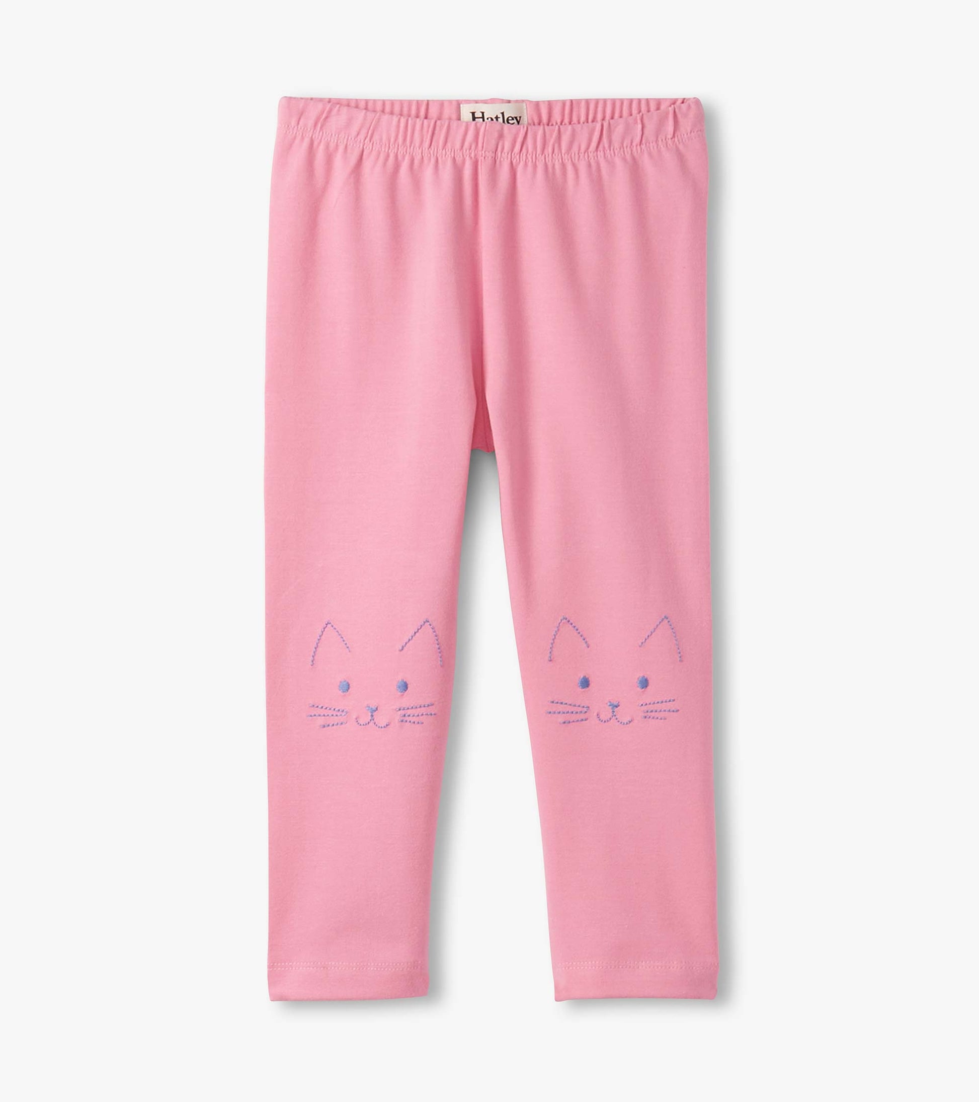 Pink leggings featuring cute cat face designs on the front, made from soft, stretchy material for comfort.