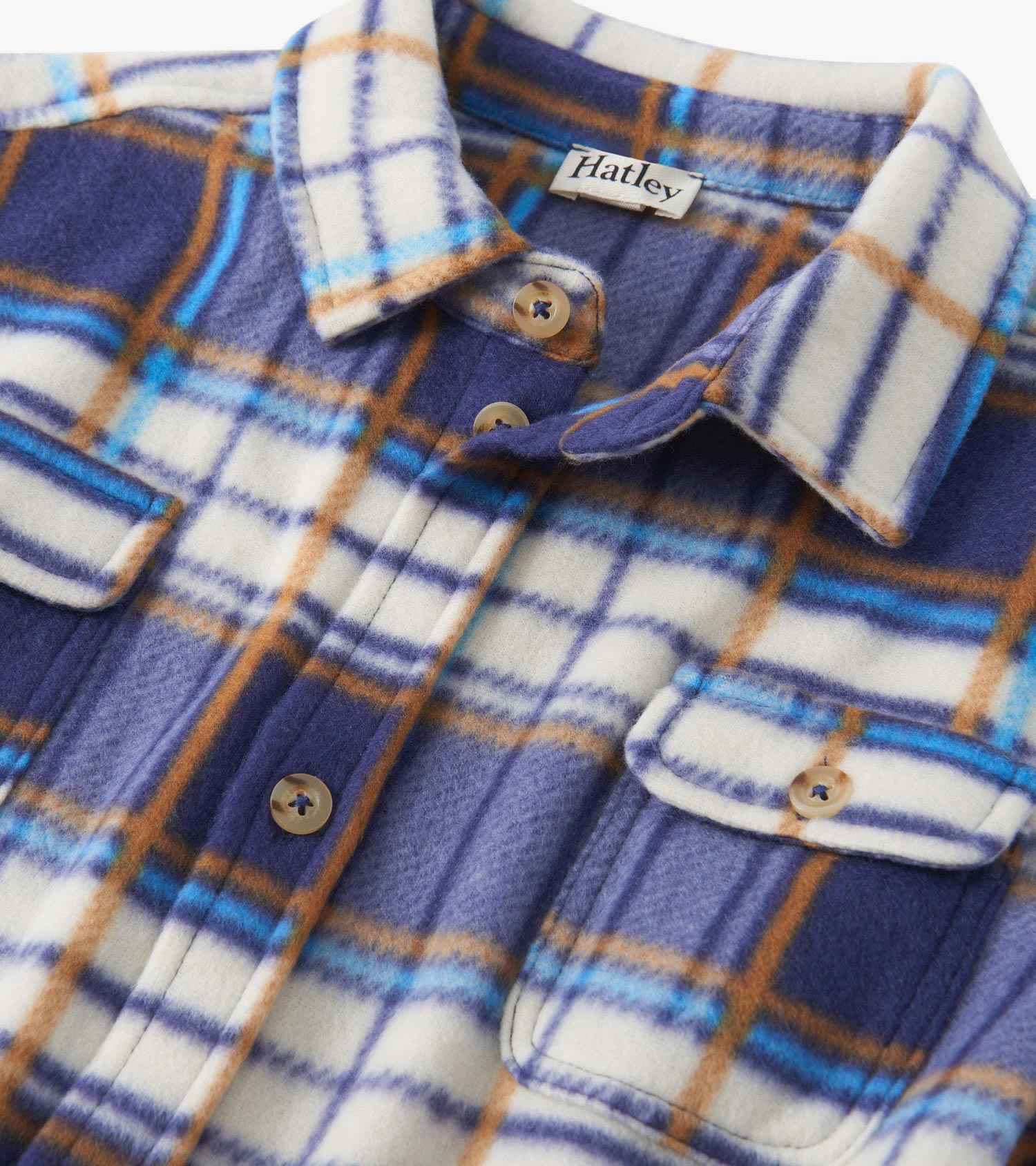 Plaid fleece button-up shirt in blue, white, and orange tones with two chest pockets and button closure.