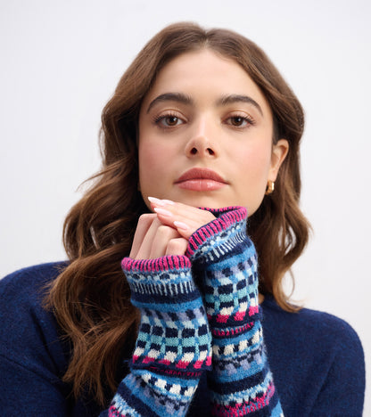 Navy sweater dress featuring colorful patterned sleeves and a cozy fit, ideal for casual wear.