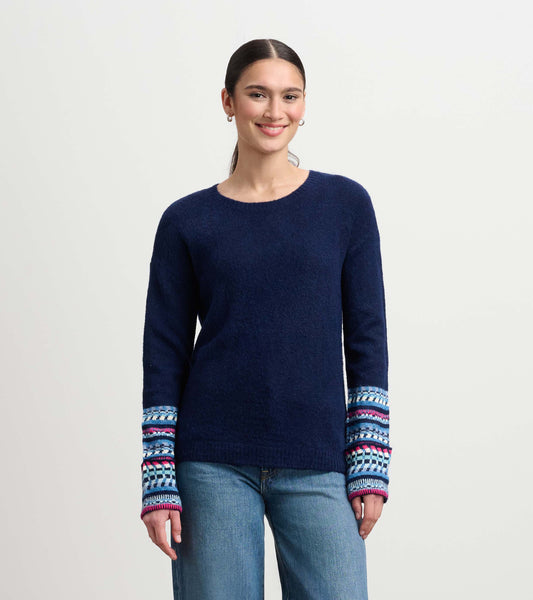 Navy sweater with patterned jacquard cuffs, featuring a round neckline and relaxed fit.