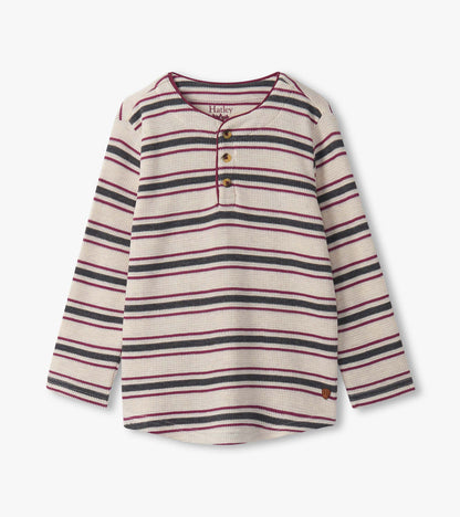 Oatmeal melange waffle henley with multicolored stripes and three-button placket, featuring long sleeves and a rounded hem.