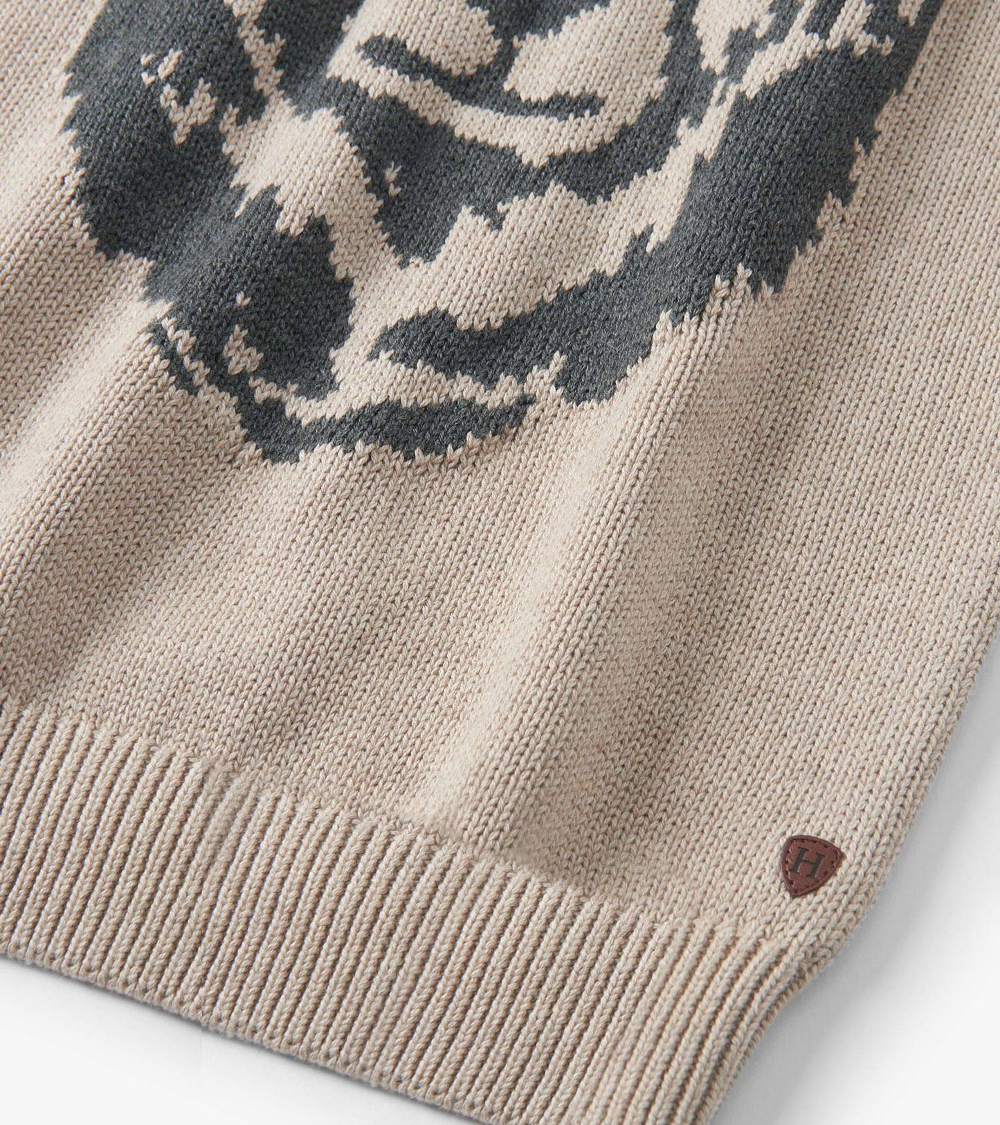 Oatmeal crew neck sweater featuring a bear design, ribbed hem, and soft knit material. Suitable for boys.