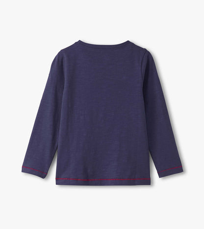 Long sleeve graphic tee in dark purple with a simple design and contrasting red stitching at the hem and cuffs.
