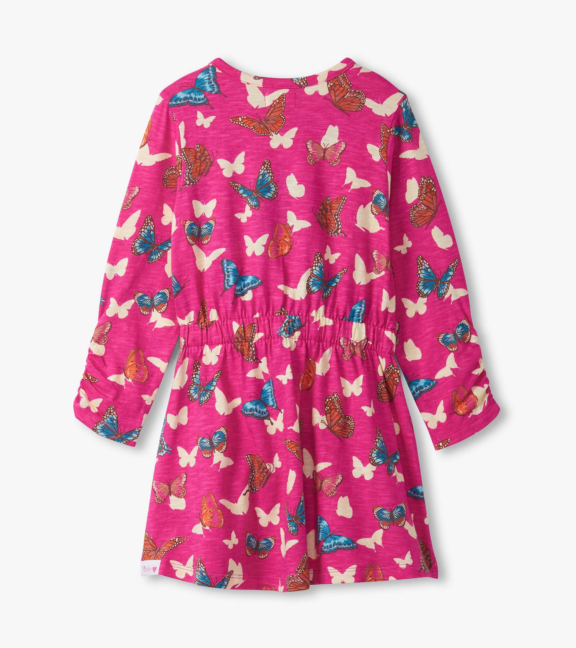 Pink dress featuring a butterfly print, cinched waist, and long sleeves, shown from the back.