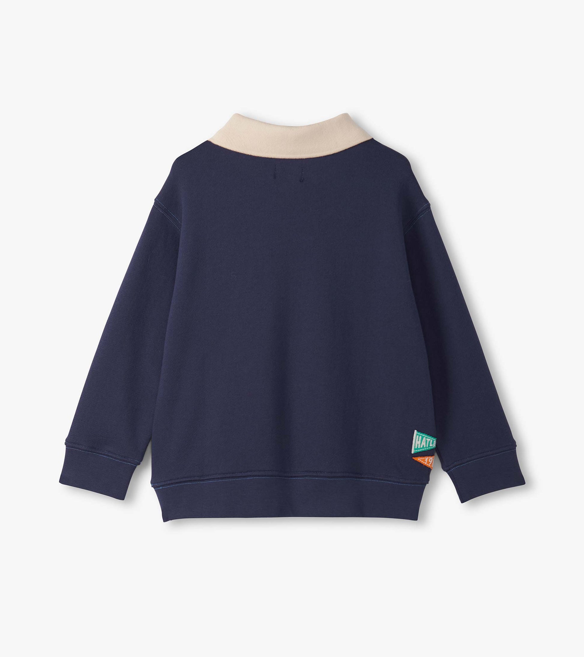 Navy blue pullover with a beige collar, featuring long sleeves and a tag on the side.