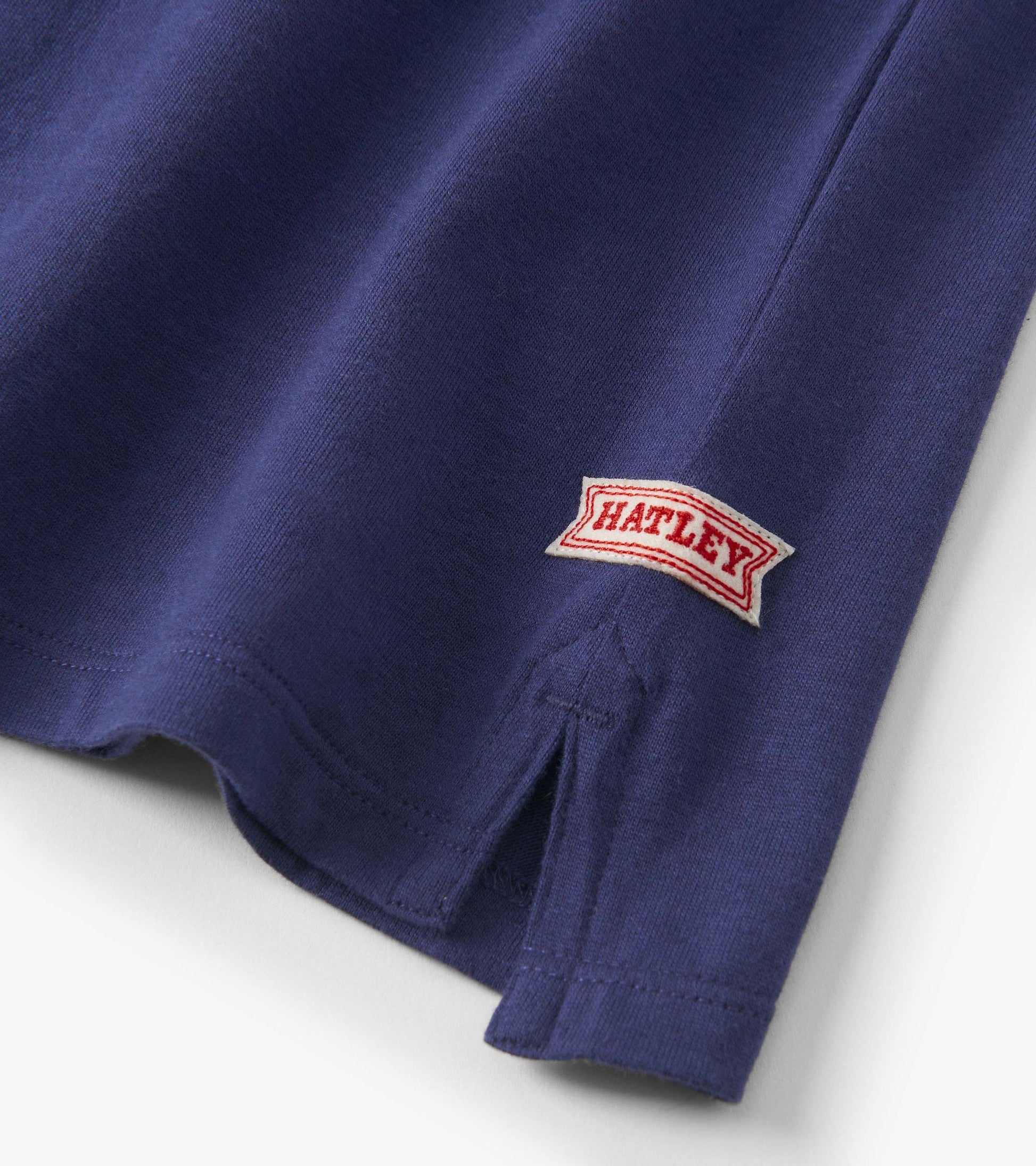 Boys' blue rugby polo featuring stripes and a side slit, made from soft cotton material.
