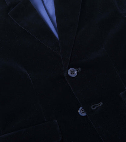 Navy velveteen blazer with a notched collar, two buttons, and front pockets, suitable for holiday occasions.
