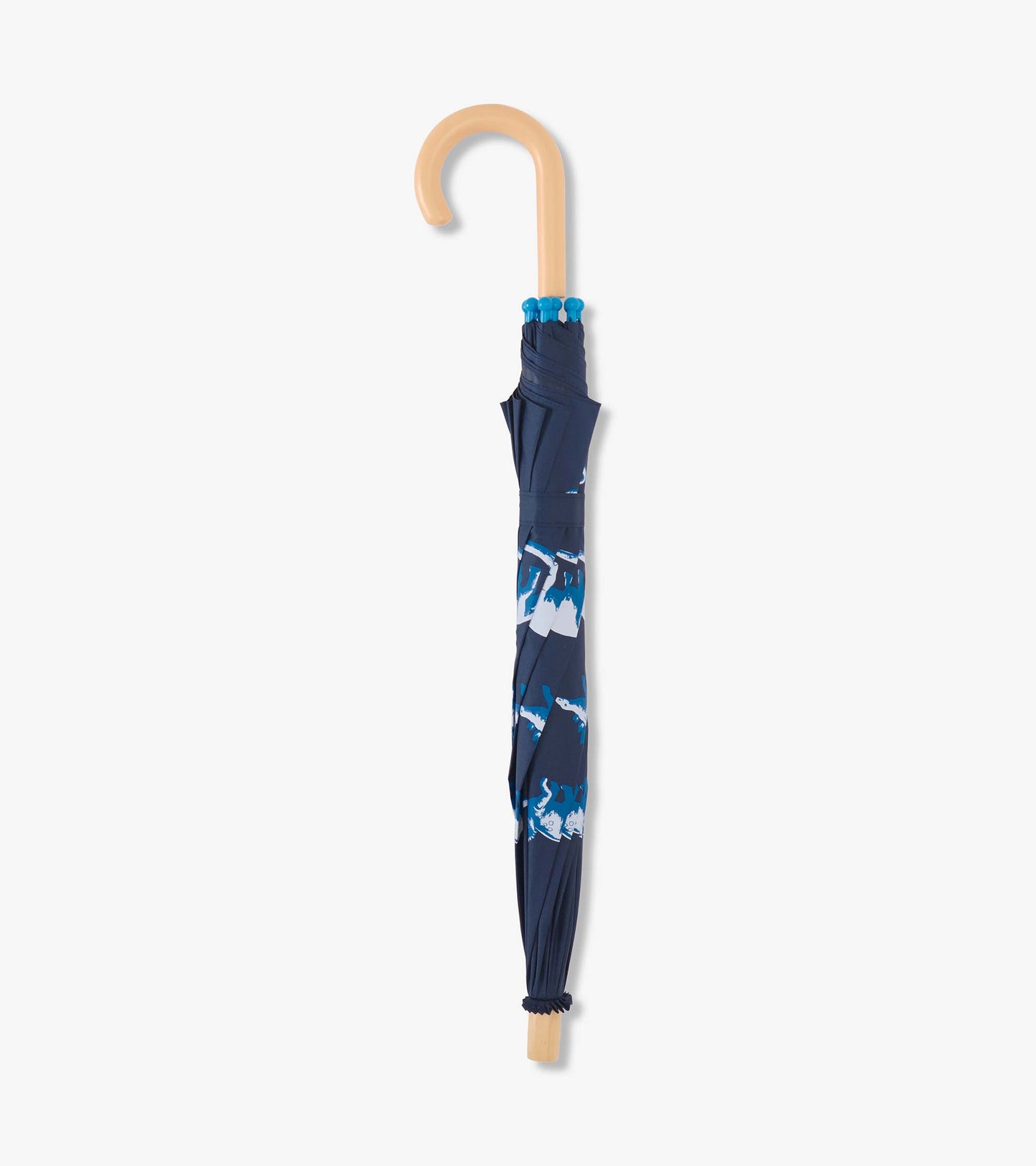 Navy umbrella featuring colorful dinosaur prints, with a curved wooden handle and gathered fabric design.