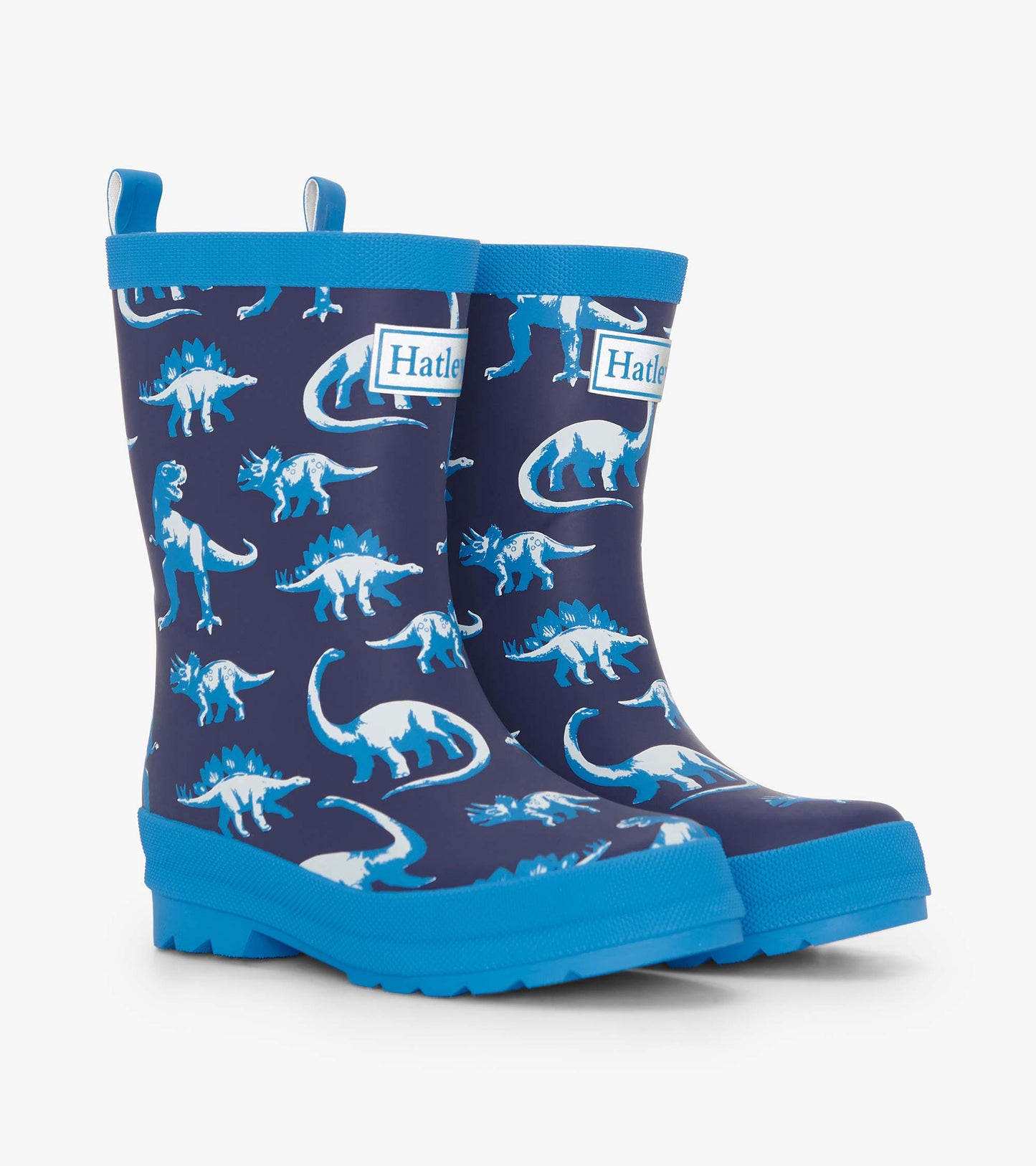 Matte navy rain boots featuring white and blue dinosaur patterns, with a textured blue sole and pull tabs for easy wear.