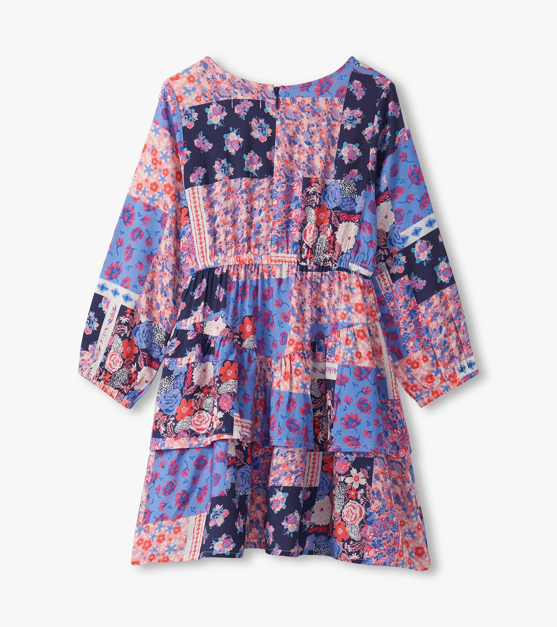 Colorful patchwork floral dress featuring long sleeves, a flounce hem, and a mix of blue, pink, and navy patterns.