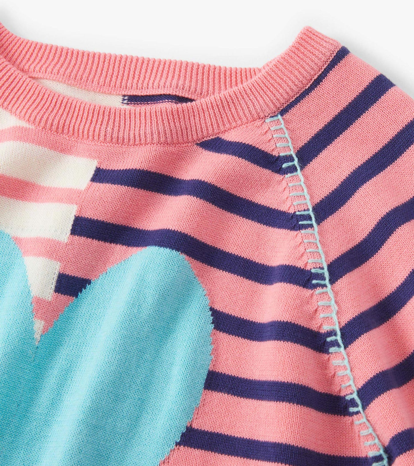 Pink and navy striped sweater featuring a large blue heart design, with a ribbed neckline and soft knit material.