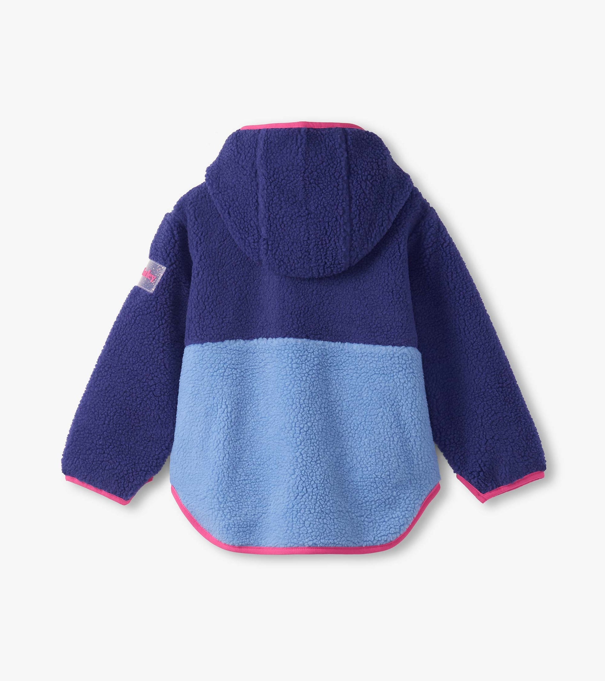 Royal blue and light blue colourblock faux sherpa jacket with a hood and pink trim, featuring a rounded hem.