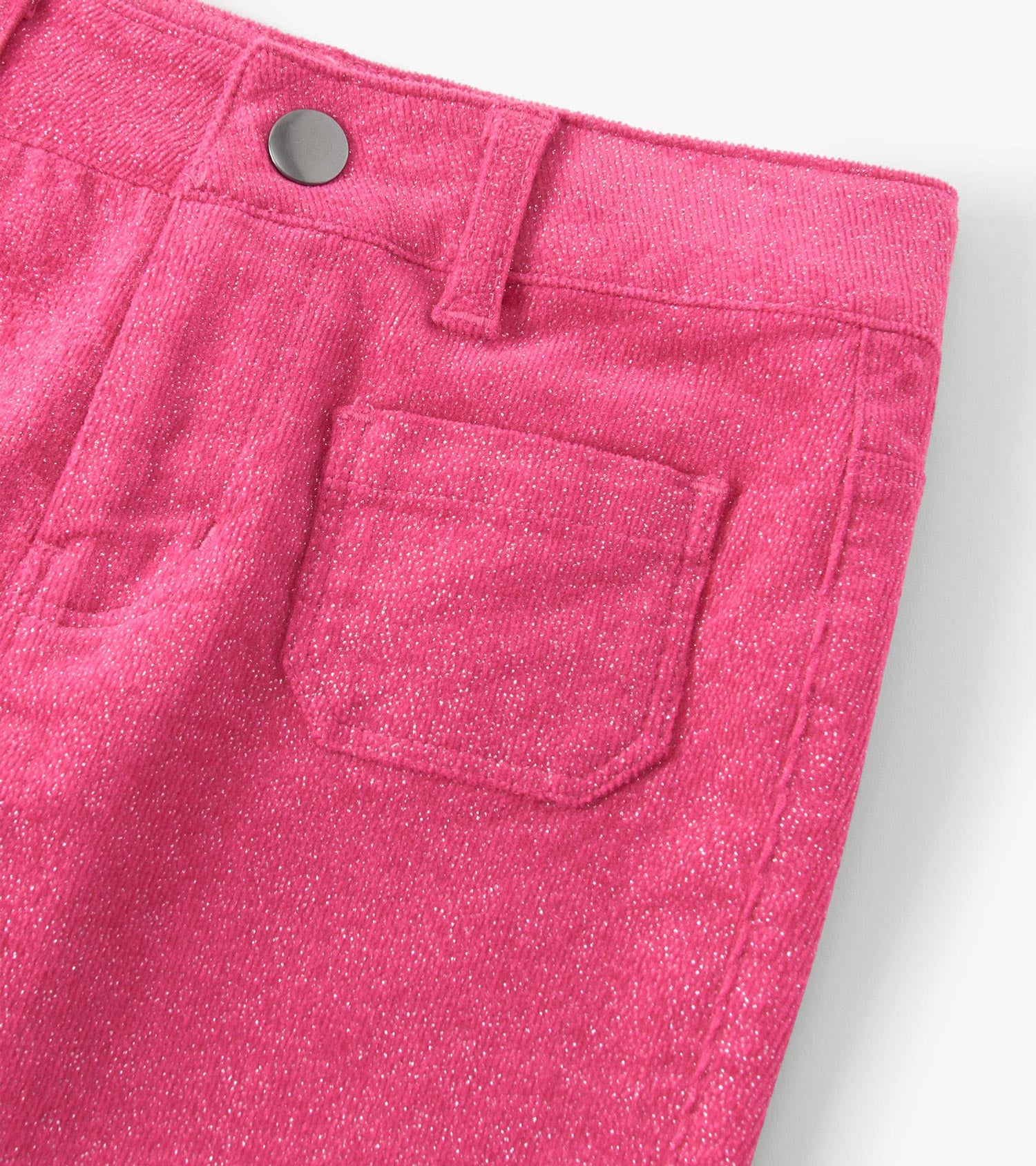 Raspberry pink flared pants with a patch pocket and textured fabric, featuring a button closure at the waist.