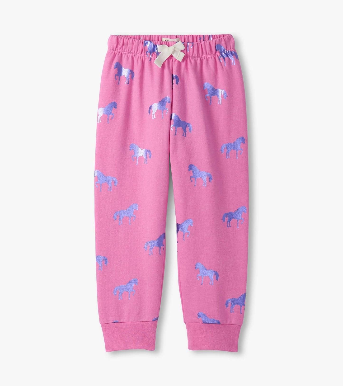 Pink cuffed track pants featuring a playful pattern of blue shimmer horses. Elastic waistband with a bow detail.