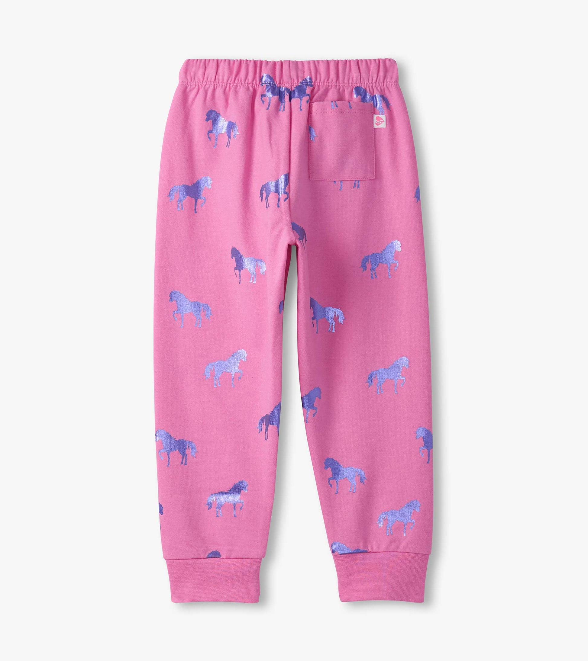 Pink cuffed track pants featuring a playful horse pattern in shades of blue, with an elastic waistband and a back pocket.