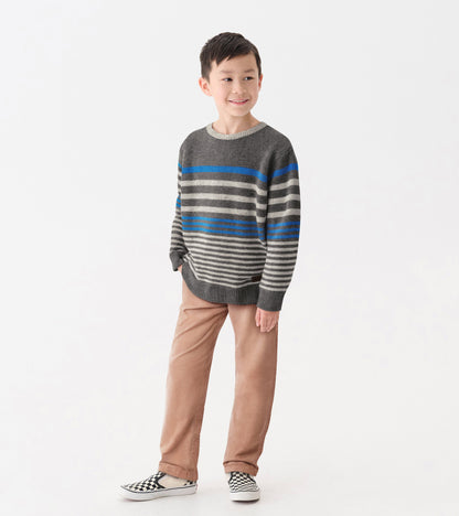 Gray crew neck sweater with blue and gray stripes, worn by a boy with beige pants and checkered shoes.
