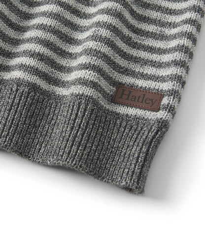 Gray crew neck sweater featuring a speckled stripe pattern and ribbed hem. Includes a small logo patch.