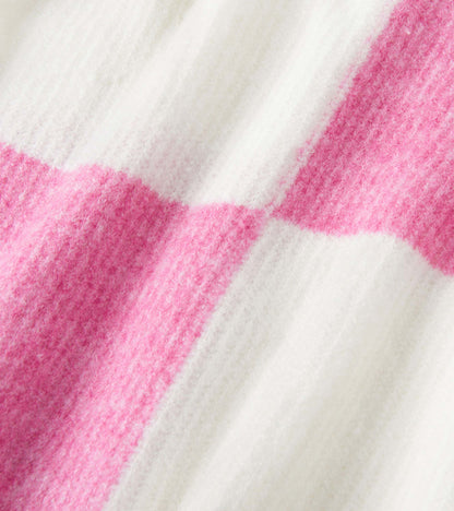 Pink and white check pattern drop shoulder sweater with a soft, textured fabric. Ideal for casual wear.