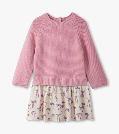 Pink knitted sweater top with a cream skirt featuring a bow print, suitable for baby and toddler girls.